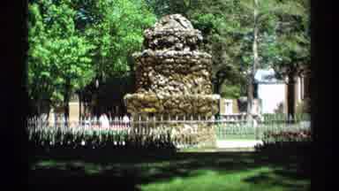 Holland Michigan (1969): A Scripture In A Park With Cars Traveling Around