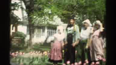 Holland Michigan (1969): Four People Stand On The Side Of A Road On Windmill
