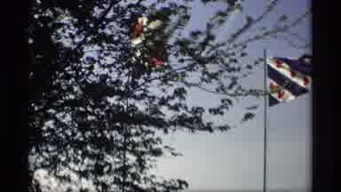 Holland Michigan (1969): Flags Waving In The Wind On A Clear Day With A Windmill