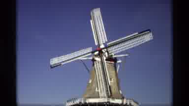 Holland Michigan (1969): Two Views Of Windmill Spinning In Breeze Flags Flying In
