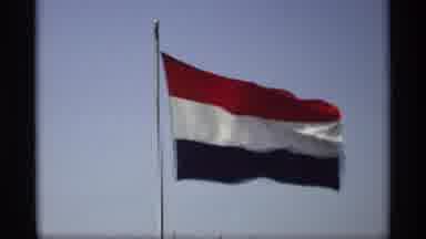 Holland Michigan (1969): View Of Flying Netherlands Flag Against Blue Sky On A