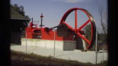 Holland Michigan (1969): Industrial Machine Outdoors On Concrete Slab With Man