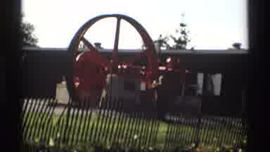 Holland Michigan (1969): A Man Working On Equipment Next To A Field Of Flowers