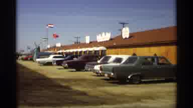 Holland Michigan (1969): Lineup Of Cars Near The Water With A Lineup Of Boats On A