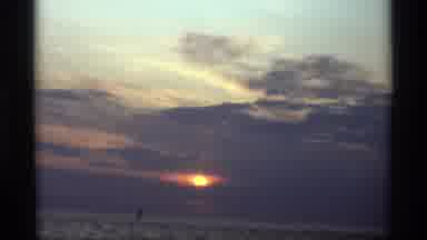 Holland Michigan (1969): Sun Peeking Through Clouds On A Sunset Near Beach