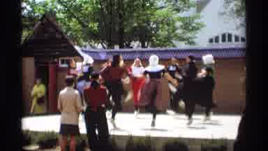 Holland Michigan (1969): People In Costumes Dancing And Kicking On A Stage While