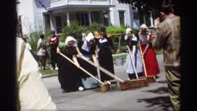 Holland Michigan (1969): Women In Pilgrim Costumes Sweep Street With Large Brooms