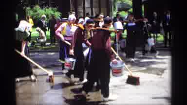Holland Michigan (1969): Women Wearing Pilgrim Costumes Sweep Street With Brooms