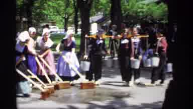 Holland Michigan (1969): Women Subbing Pavement With A Broom Men Putting Water On