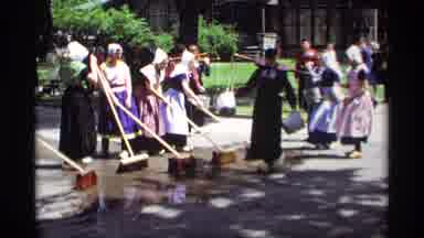 Holland Michigan (1969): Amish Women Cleaning The Street With Water And Caring