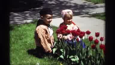 Holland Michigan (1969): Multiple Colored Tulips Grace Garden Where Two Children