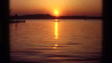Holland Michigan (1969): Small Boat In The Middle Of A Lake With The Bright Orange