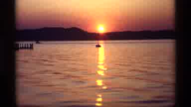 Holland Michigan (1969): Boat At A Distance Sailing In A Body Of Water While The
