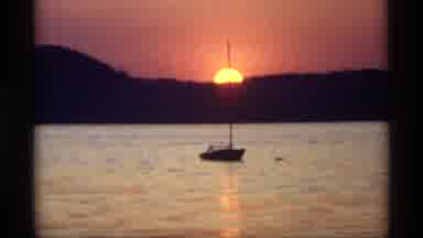 Holland Michigan (1969): A Small Boat Sitting In The Middle Of A Body Of Water