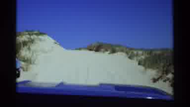 Holland Michigan (1969): Man Driving A Blue Car In The Morning On A Dunes Trip