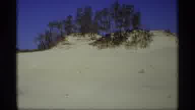 Holland Michigan (1969): Sand Dune Near Beach Pulls People Towards Water For