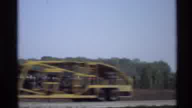 Holland Michigan (1969): Vehicles Zooming Across Highway As Train Sits In