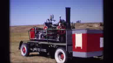Jordan Minnesota (1969): View Of Red And White Tractor On A Bright Sunny Day