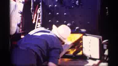 Jordan Minnesota (1969): Worker Throwing Wood Into Fiery Furnace In Order To Fuel