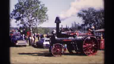 JORDAN MINNESOTA-1969: Red And Black Steam Tractor At Outdoor Fair With Steam