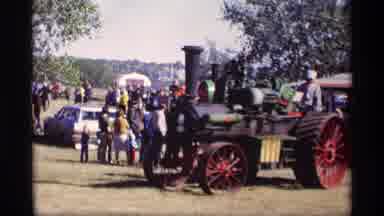 Jordan Minnesota (1969): A Crowd Of People Watching Old Style Tractors Driving