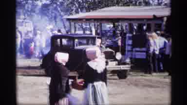Jordan Minnesota (1969): Black Vintage Car Rolls Down Dirt Road On A Sunny Day