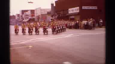 Mabel Minnesota (1969): Synchronized Group Of Men On Motorbikes On A March On A