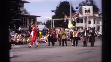 Mabel Minnesota (1969): Parade Band Marching Down The Street With Signs In A Rural