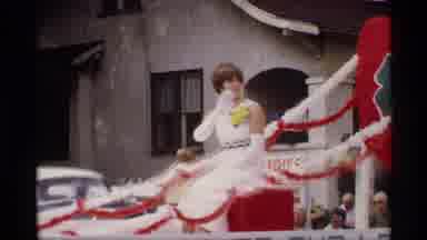 Mabel Minnesota (1969): A Noble Well Dressed Lady Waves The Crowd While Sitting On