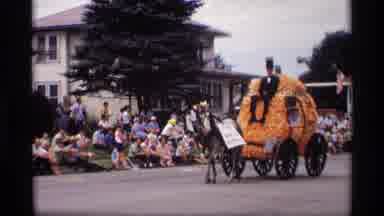 Mabel Minnesota (1969): Horse Drawn Carriages In Parade Down Residential Street