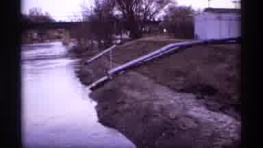 Rockford Minnesota (1969): Water Being Diverted Into Flowing River As It Passes