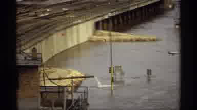Saint Paul Minnesota (1969): View Of Tan Bridge Over Water On A Cloudy Day