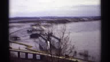 Saint Paul Minnesota (1969): People Looking At Frozen Lake And Bridge On A Cloudy