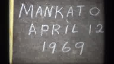 Savage Minnesota (1969): The Chalkboard Sitting On The Tree Stump Says Mankato