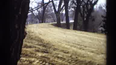 Savage Minnesota (1969): Graded Dirt Embankment Near Body Of Water And Trees