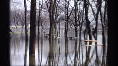 Savage Minnesota (1969): Flooded Forest Frozen And Snowy Concrete Building In
