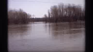 Savage Minnesota (1969): Vehicles On The Roadway Near The Water Trees And