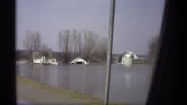Savage Minnesota (1969): Driving Along Road Near Flooded Fields Houses Submerged