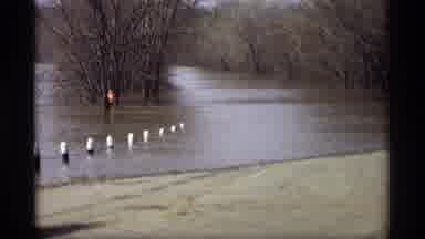 Savage Minnesota (1969): Men On Vehicle Boat Assess And Prepare To Enter Street