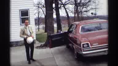 Savage Minnesota (1969): A Red Car Sitting In The Driveway With The Driver
