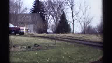 Savage Minnesota (1969): Man Parks Car Then Drives The Car Slowly Around The Dirt