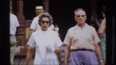 Wisconsin-1969: People Walking Away From An Older House