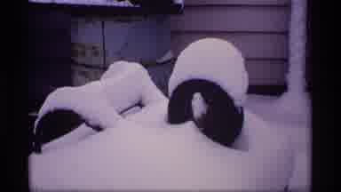 Wisconsin (1969): View Of Snow Covered Barbecue Grill And Bench On A Clear Winter