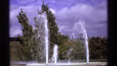 Canada (1974): Shooting Water Fountain On Sunny Day And Trees With Changing Leaves