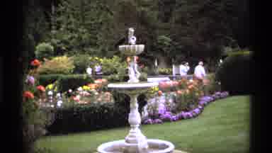 Vancouver Canada (1974): People Walk Through Decorated Flower Garden With