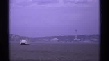 Vancouver Canada (1974): Ferry Moving On The Water On A Cloudy Day With A Blue Sky