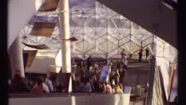 Montreal Canada (1967): People Riding An Escalator In A Building Decorated With