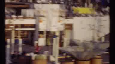 Montreal Canada (1967): Crowds Gather Around Red And Gold Buildings On A Sunny Day