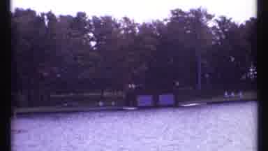 Montreal Canada (1967): Overlooking The Waters Edge As An Individual Is Rowing