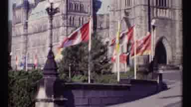 Ottawa Canada (1967): Several Canadian Flags Blowing In The Wind In Front Of Some
